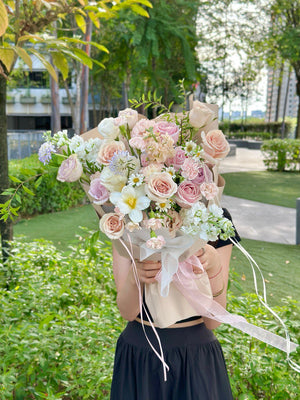 Elegant blush quicksand rose bouquet with white tulips and greenery, perfect for romantic occasions.