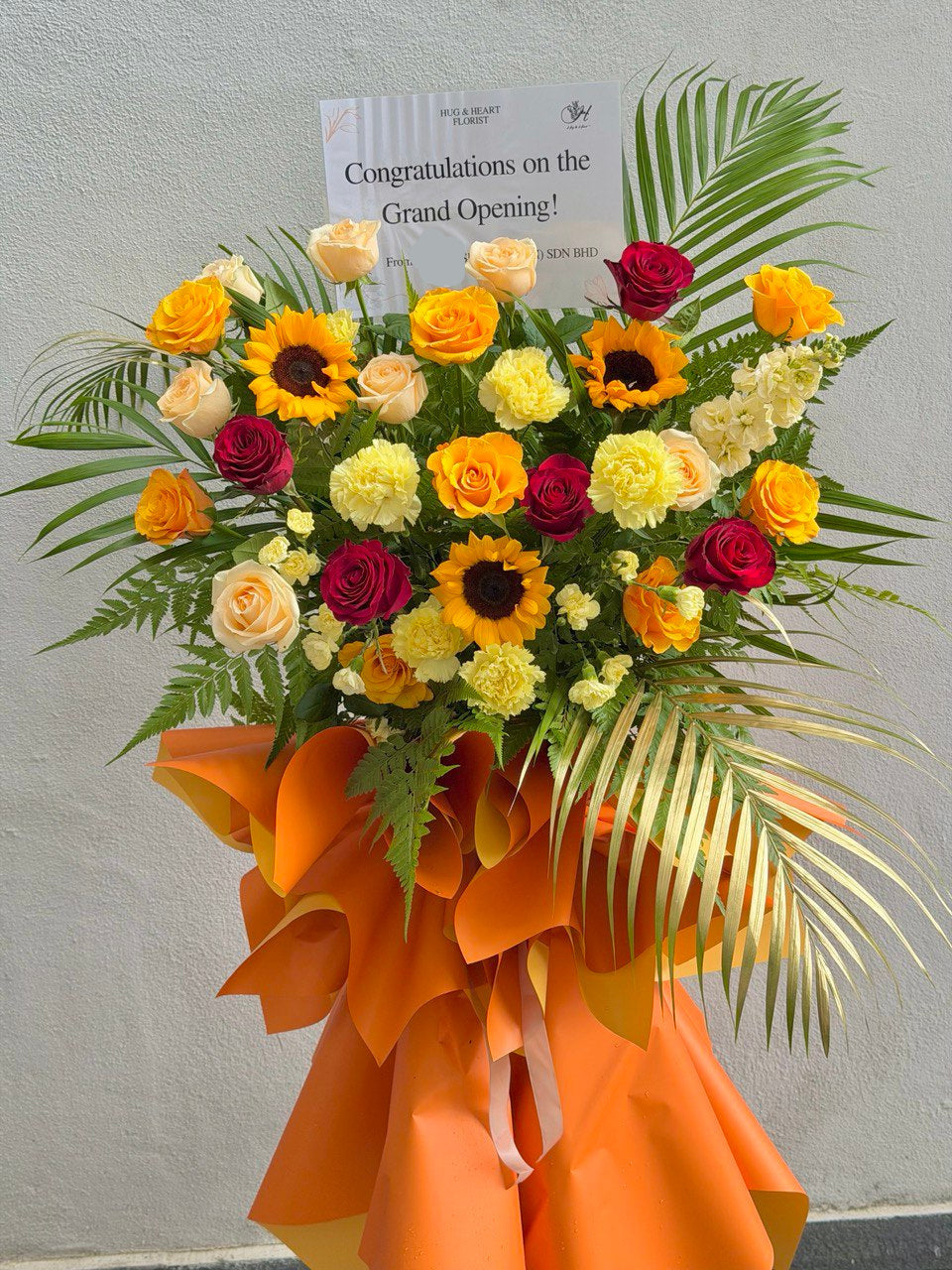 Orange theme with sunflower grand opening flower stand perfect for business opening flower stand gifting with delivery at Kuala Lumpur.