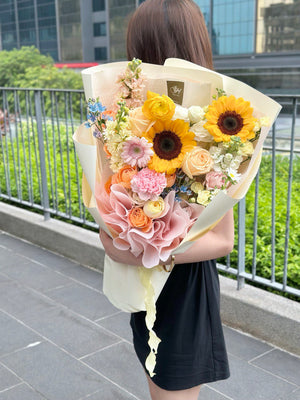 1. A woman holds a vibrant bouquet of sunflowers, symbolizing graduation and well wishes, outside a shop in Sunway Subang Jaya.
2. A woman proudly displays a bouquet of sunflowers, perfect for graduation and get well soon occasions, near a shop in Sunway Subang Jaya.
3. A woman with a cheerful bouquet of sunflowers, ideal for graduation celebrations and get well soon messages, outside a shop in Sunway Subang Jaya.