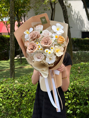 Luxury soap flower bouquet in neutral cream tones with artificial roses and plumeria flowers for everlasting floral gift.