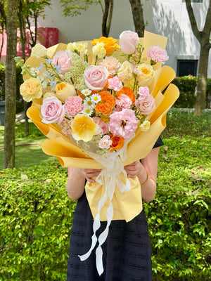 Premium pastel mixed flower bouquet with happy vibrant colours and yellow wrapping, perfect for sending love and joyful surprises, same day flower delivery bukit jalil florist.