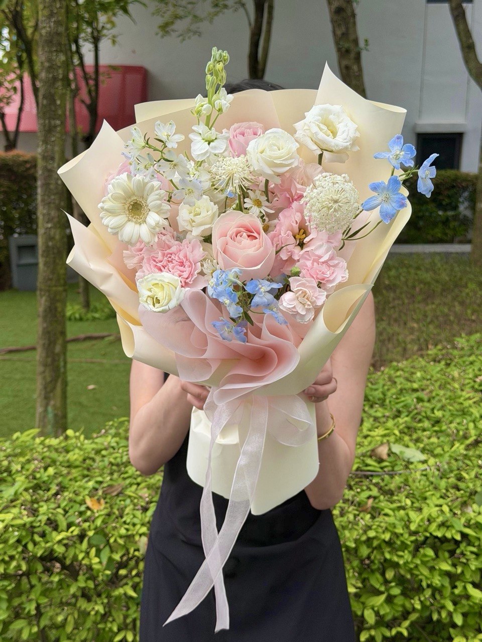 Elegant pastel flower bouquet featuring pink roses, white gerbera, carnations, and blue delphinium flowers with same day flower delivery in Kuala Lumpur and Selangor.