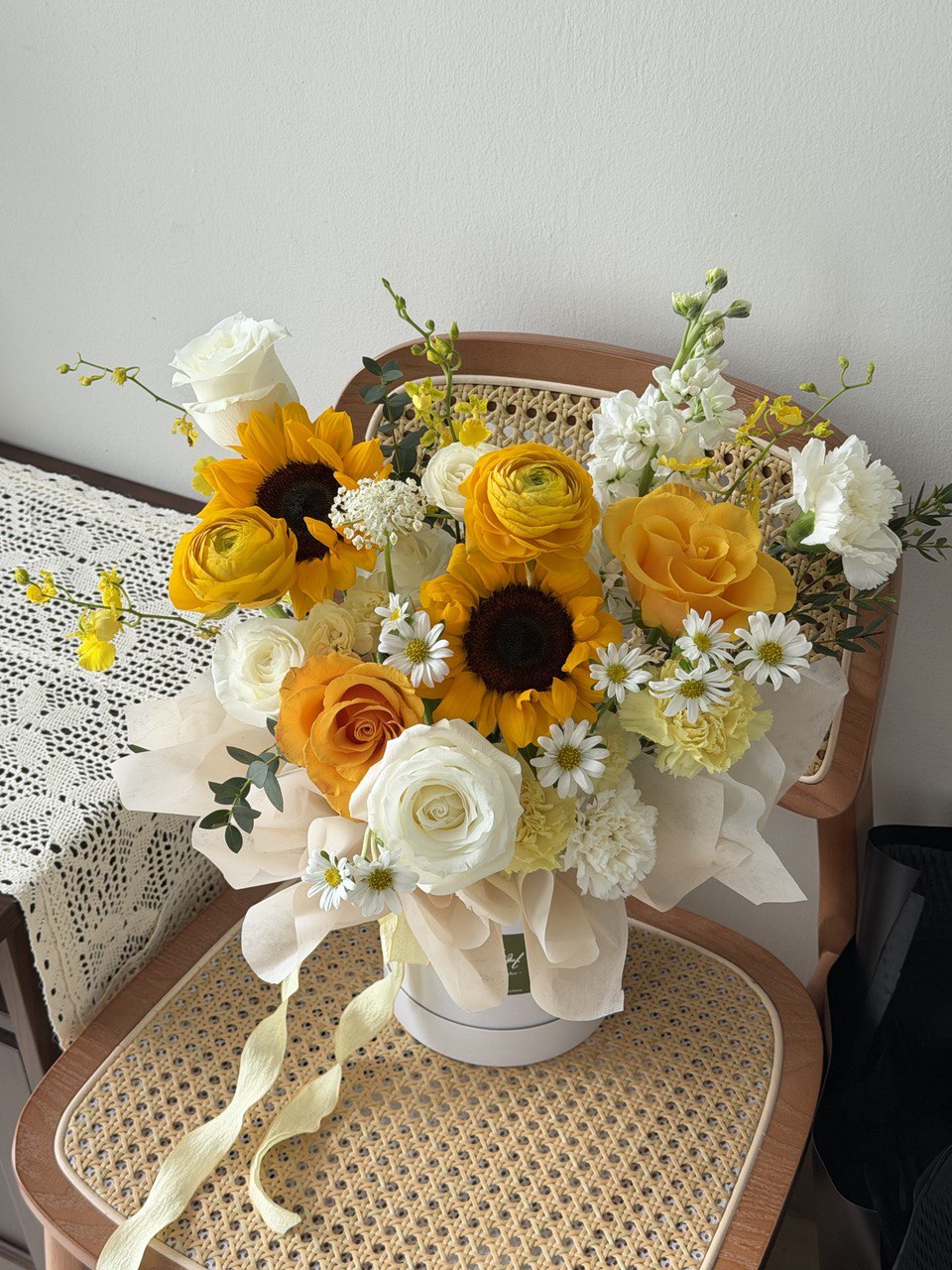 Floral arrangement with sunflowers, roses, and daisies on a box, this gift is perfect for house warming, business opening and just because.