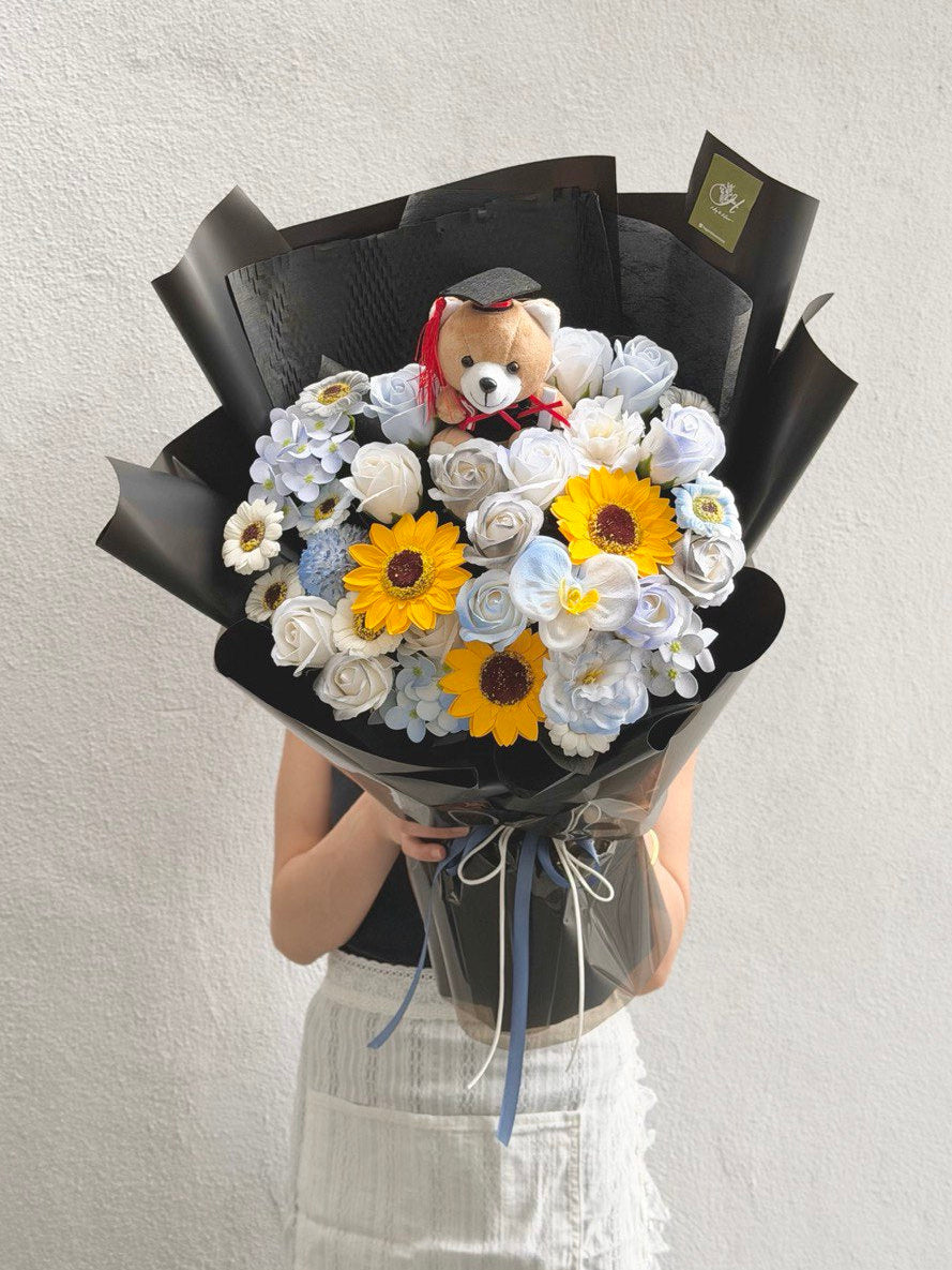 A bouquet of graduation soap flower is held by a girl ideally for graduation at Kuala Lumpur and Selangor with same day delivery.