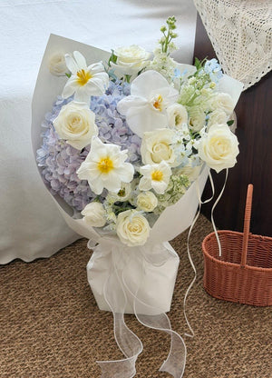 Luxury hydrangea bouquet mixed with white roses, tulips and Phalaenopsis orchids.