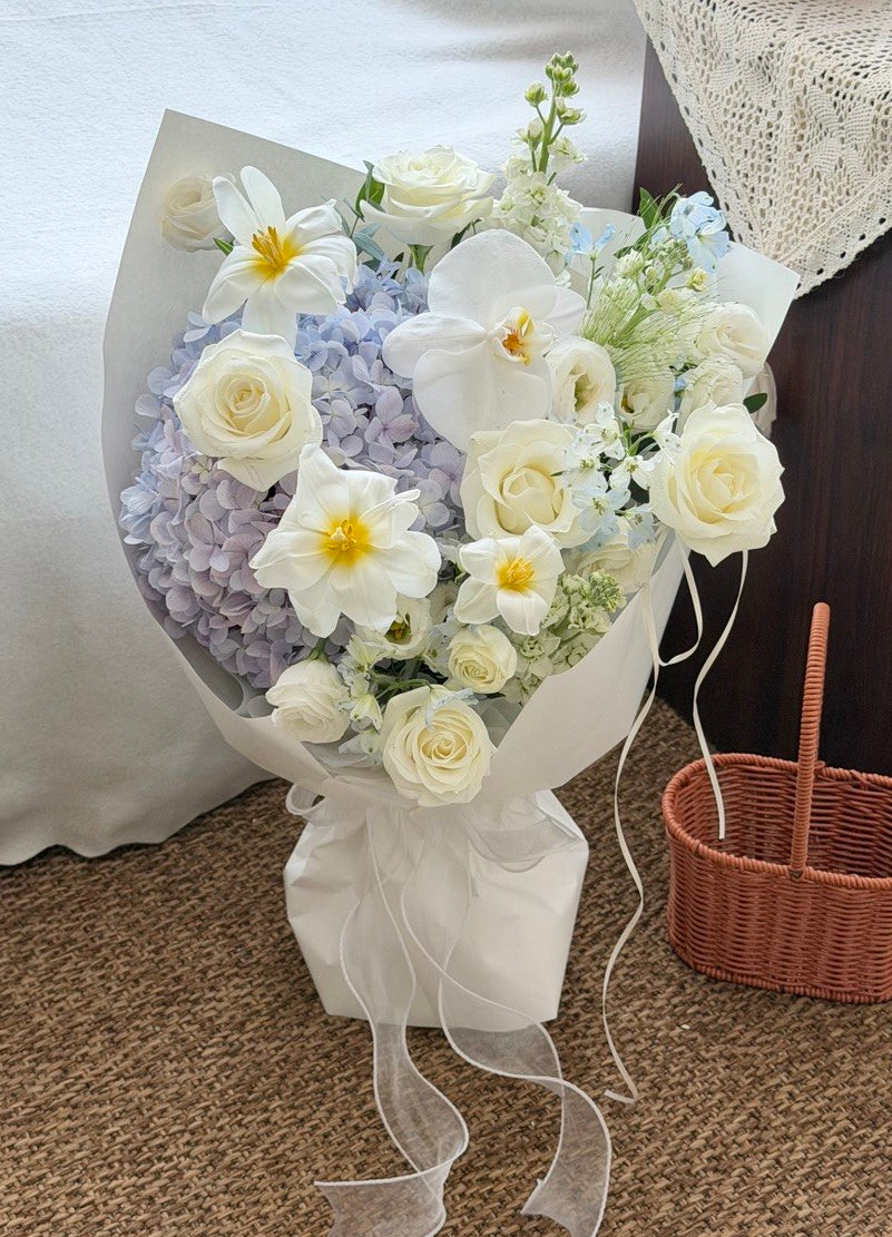 Luxury hydrangea bouquet mixed with white roses, tulips and Phalaenopsis orchids.