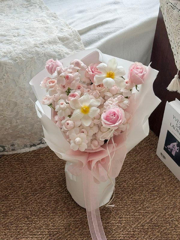 Kiss of Fairy flower bouquet with pink roses and soft blooms for birthday.