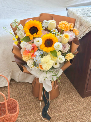 A bouquet of flower mixed with sunflower prepare by Hug and Heart Subang Jaya.