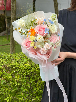 Pastel pink rose bouquet with blue delphinium, hana white, chamomile, carnations, and fresh seasonal flowers, perfect for gifting with same-day flower delivery in Kuala Lumpur and Selangor.