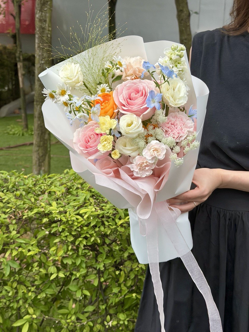Pastel pink rose bouquet with blue delphinium, hana white, chamomile, carnations, and fresh seasonal flowers, perfect for gifting with same-day flower delivery in Kuala Lumpur and Selangor.