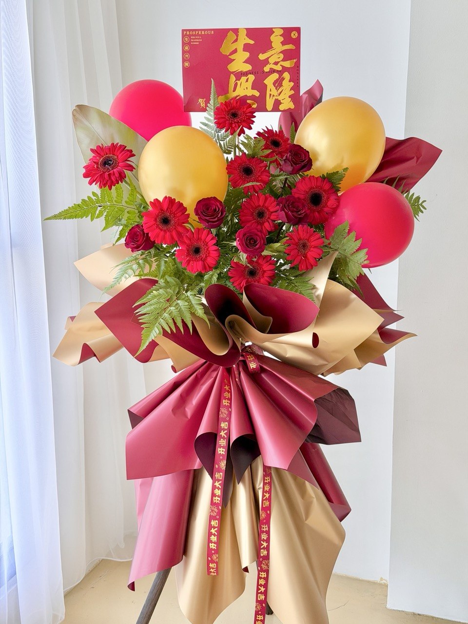 Prosperous business grand opening flower stand with red gerbera and balloons – Kuala Lumpur and Selangor same day flower stand delivery