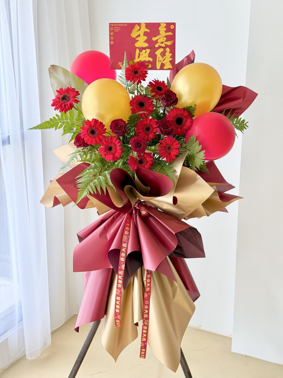 Red gerbera grand opening flower stand with balloons – same day grand opening flower delivery in Kuala Lumpur and Selangor by Hug and Heart Florist.