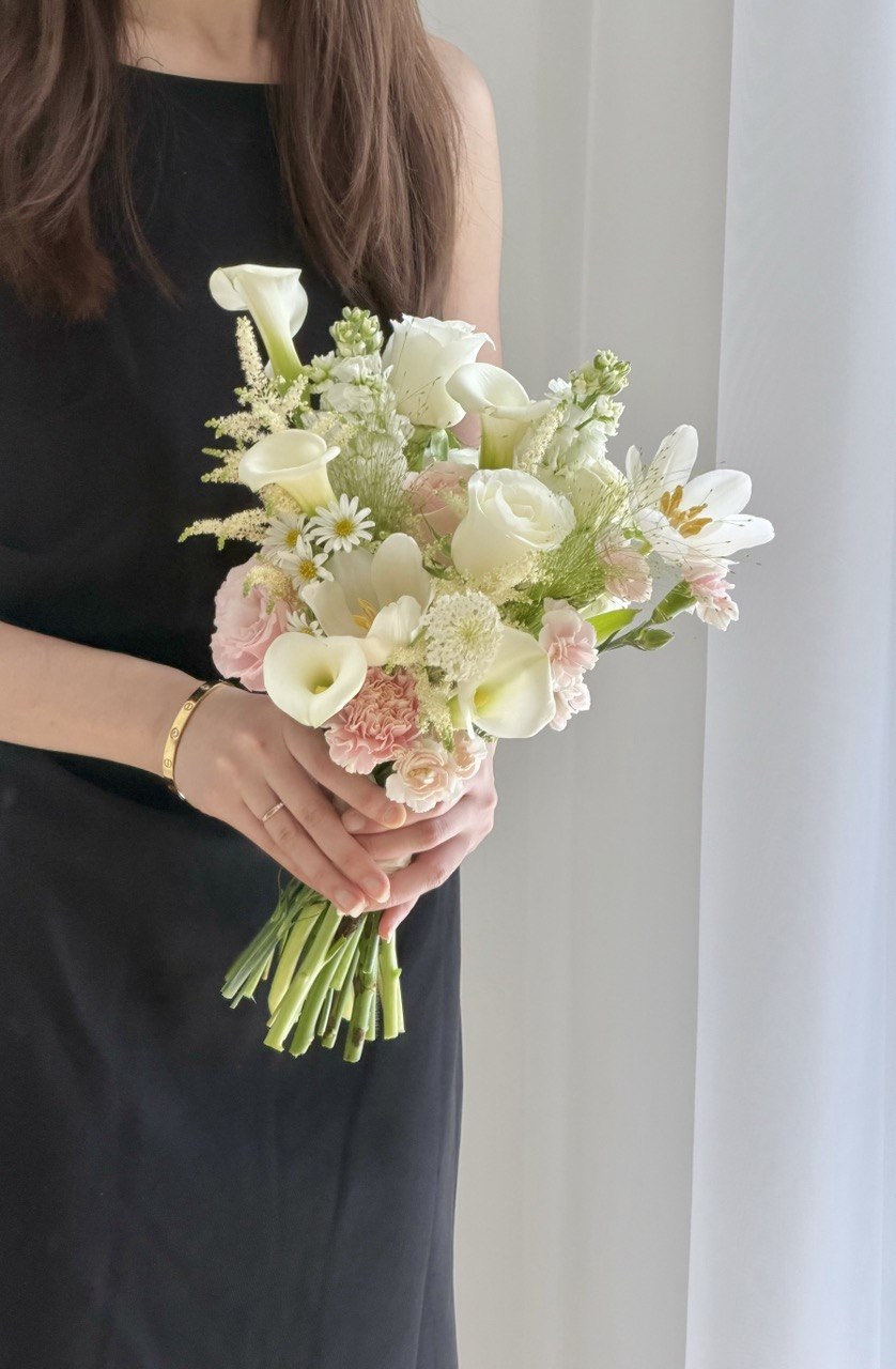 Premium hand-tied bridal bouquet with elegant white calla lilies, tulips, white roses, pink roses and astilbe, ideal for wedding photography and same day flower delivery KL.