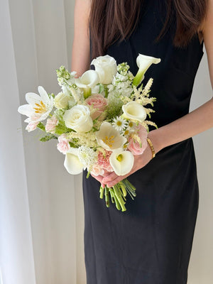 Elegant hand bridal bouquet with white calla lily, white tulips, white roses, blush pink roses, astilbe and fresh flowers for ROM wedding in Kuala Lumpur with same day flower delivery.