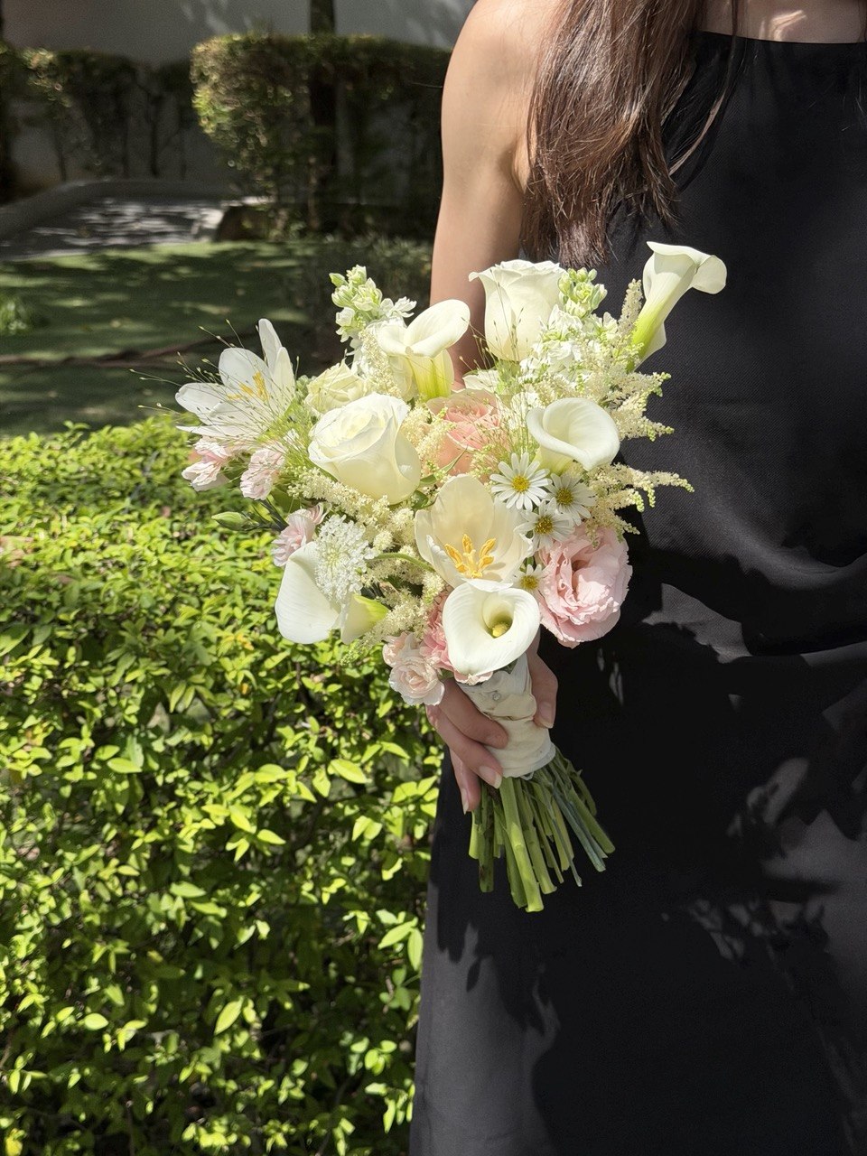 Luxury white and blush pink bridal bouquet featuring calla lilies, tulips, white roses, pink roses and astilbe, perfect for wedding and ROM ceremony in KL and Selangor.