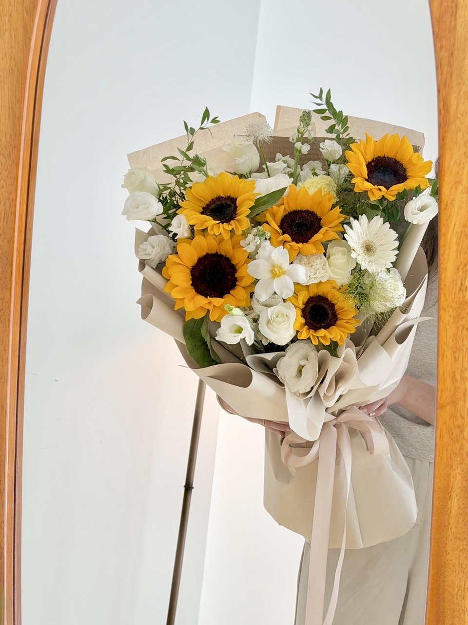 Yellow sunflower bouquet with white flowers, perfect for graduation gifts and celebrating academic achievements.