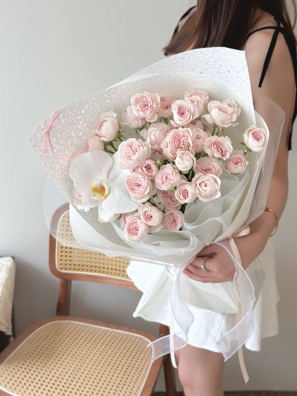 A girl is holding a kiss of fairy bouquet ready for her birthday celebration at Kuala Lumpur Malaysia.