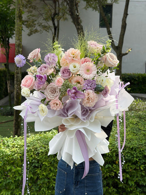 Fresh pastel mixed flower bouquet with roses, gerbera daisies and carnations, modern floral design for gifting in Kuala Lumpur.