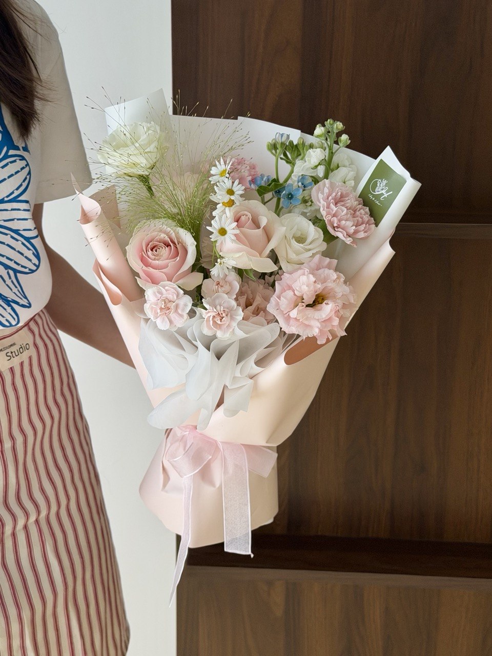 Elegant small anniversary flower bouquet with pink roses and fresh blooms for a romantic surprise.