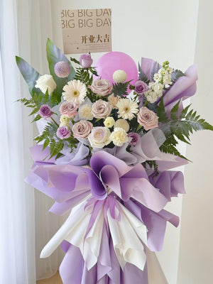 Purple theme grand opening flower stand with roses and gerbera, elegant pastel arrangement, same day delivery Kuala Lumpur Selangor florist.