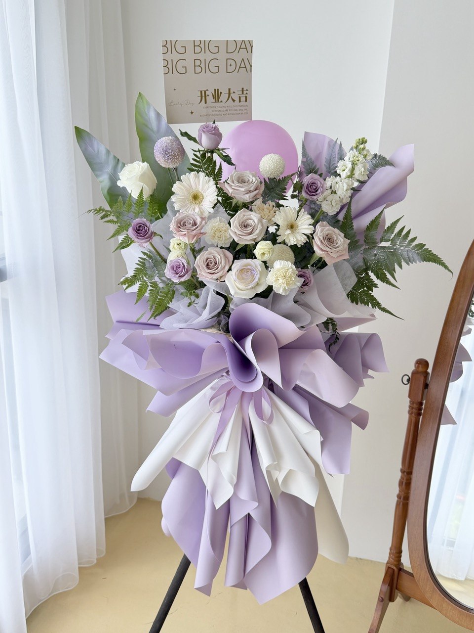 Elegant lavender grand opening flower stand with mixed blooms and modern wrapping, same day flower delivery Kuala Lumpur and Selangor.