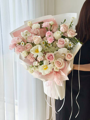 Premium anniversary flower bouquet with pastel pink roses, carnations and orchids | Same Day Flower Delivery