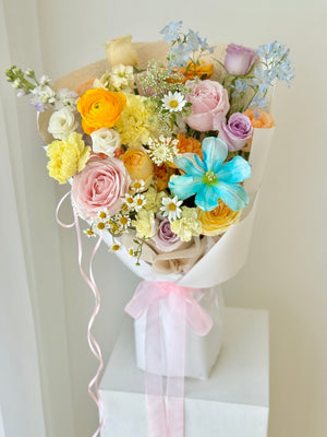 Soft pastel bouquet with blue tulip, pink roses and ranunculus flowers, perfect romantic gift with same day flower delivery Kuala Lumpur.