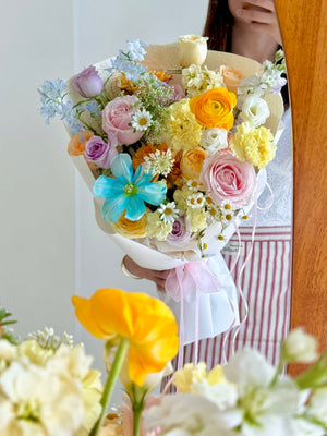 Pastel mixed flower bouquet featuring blue tulip, ranunculus and soft pink roses, ideal for birthdays and anniversaries, Kuala Lumpur same day delivery.