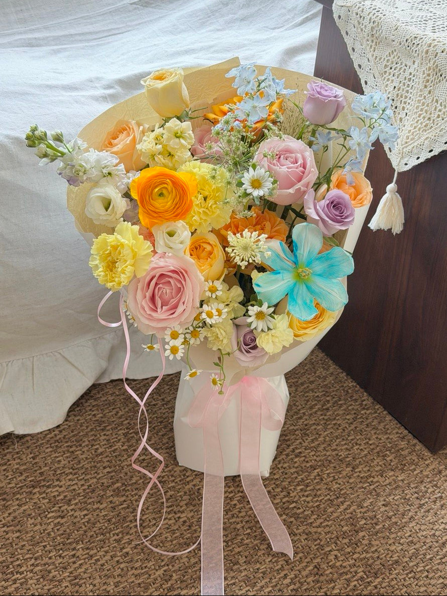 Mix colour bouquet with blue tulip, ranunculus, pink roses and buttercup roses, perfect for birthday and anniversary gift, same day flower delivery Kuala Lumpur.