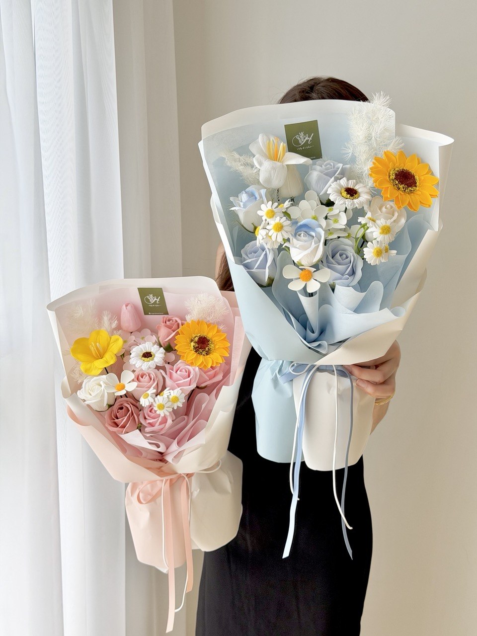 A girl is holding a soap flower with sunflower perfect for graduation at university at Subang Jaya, Bukit Jalil.