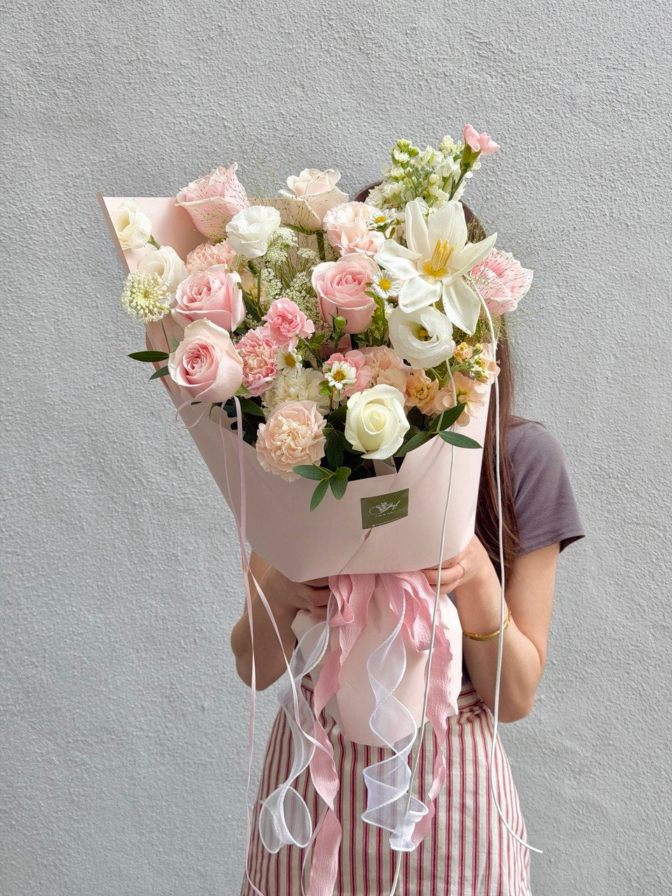 Elegant pink rose bouquet with white tulip and fresh seasonal flowers handcrafted by a local florist in Subang Jaya.
