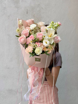 Premium pink rose bouquet featuring white Tulip, carnations, and fresh blooms for birthday and anniversary delivery in Subang Jaya.