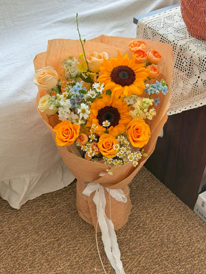 Graduation sunflower bouquet with orange roses and fresh seasonal flowers for university convocation in Sunway and Bukit Jalil.