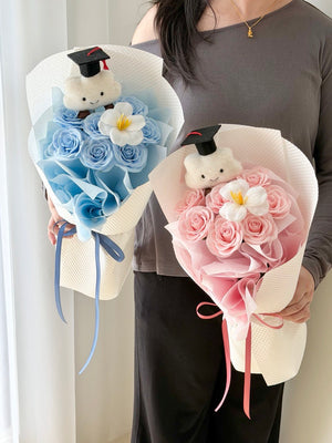 Graduation soap flower bouquet with white tulip, cloud bear wearing graduation cap, and pink and blue soap roses for convocation in Sunway and Bukit Jalil.