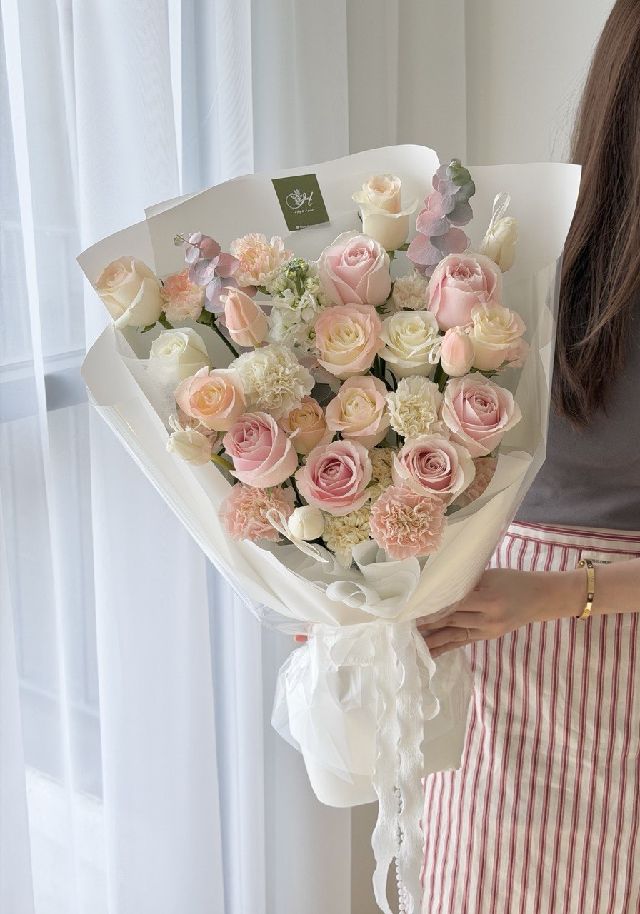 A girl is holding a large bouquet of flower perfect flower flower birthday, anniversaries celebration at Kuala Lumpur.