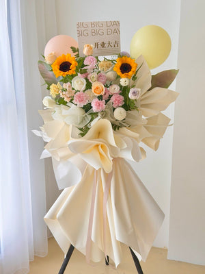 Cream colour grand opening flower stand with sunflower and pastel roses for business opening in Kuala Lumpur.