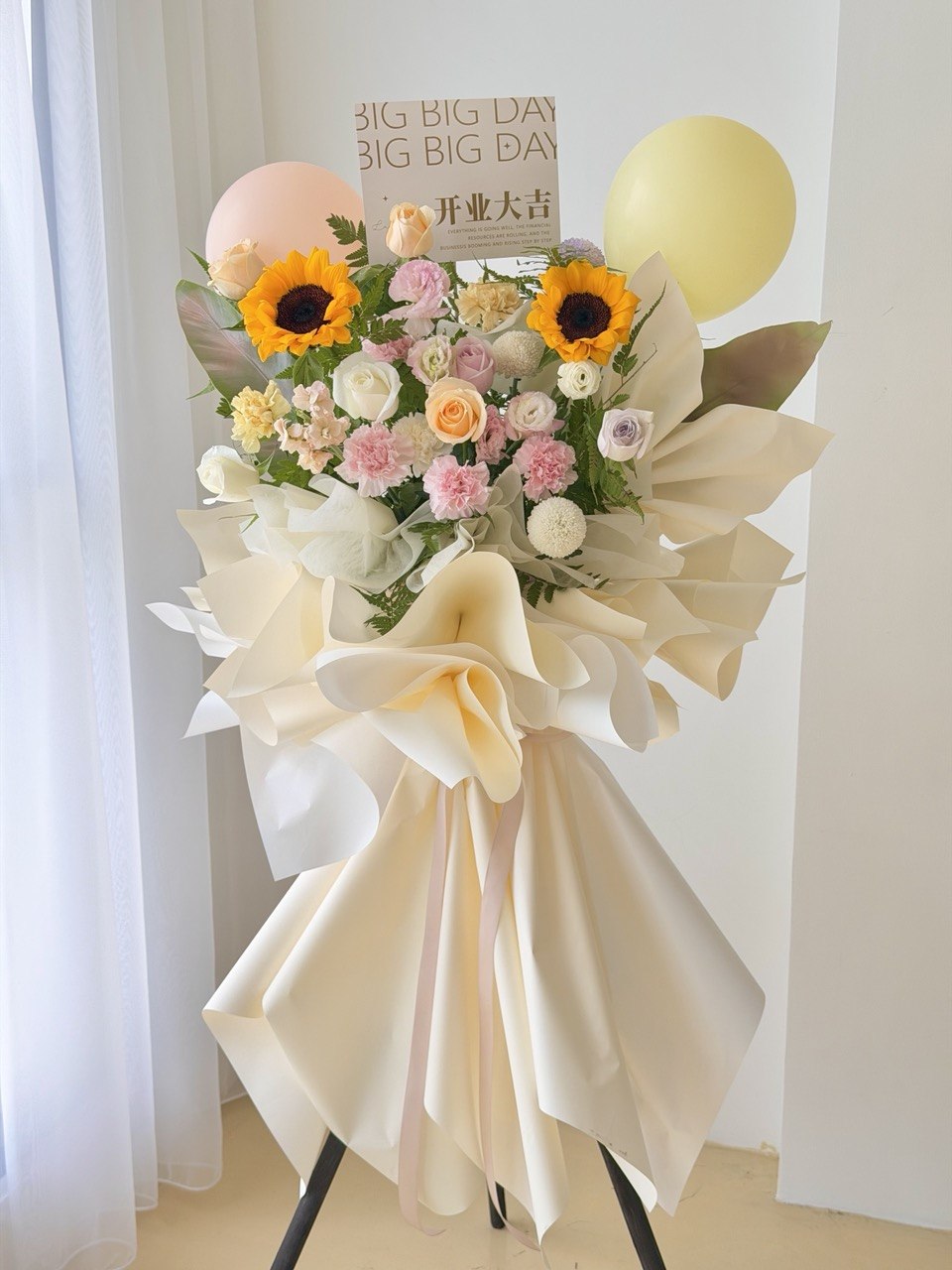 Cream colour grand opening flower stand with sunflower and pastel roses for business opening in Kuala Lumpur.