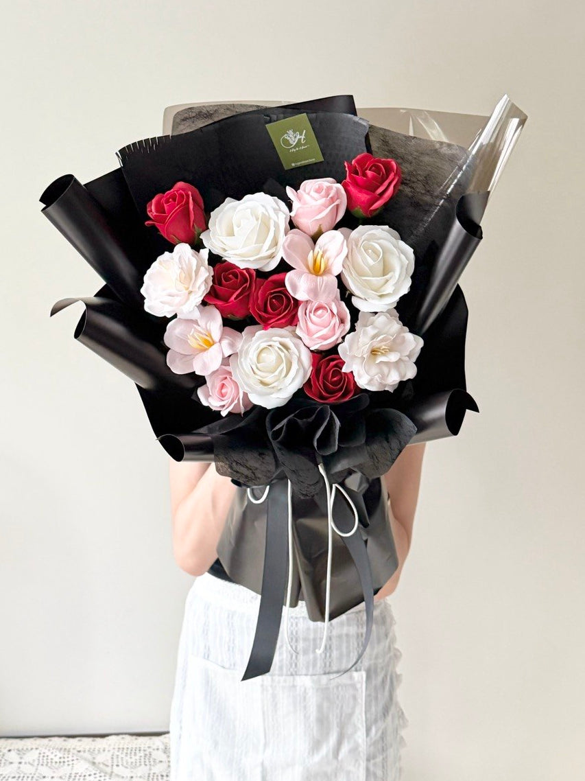 A bouquet of soap flower with white rose, pink rose, pink tulip wrapped in black wrapper perfect for anniversaries, birthday flower gift with same day flower delivery ion subang jaya and klang valley.