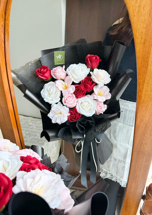 A bouquet of soap flower with white rose, pink rose, pink tulip wrapped in black wrapper perfect for anniversaries, birthday flower gift with same day flower delivery ion subang jaya and klang valley.