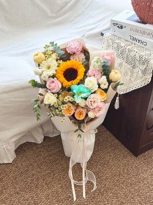 Premium graduation bouquet with sunflower, white gerbera, peach roses, pink carnations and fresh seasonal flowers, perfect graduation gift in Kuala Lumpur.