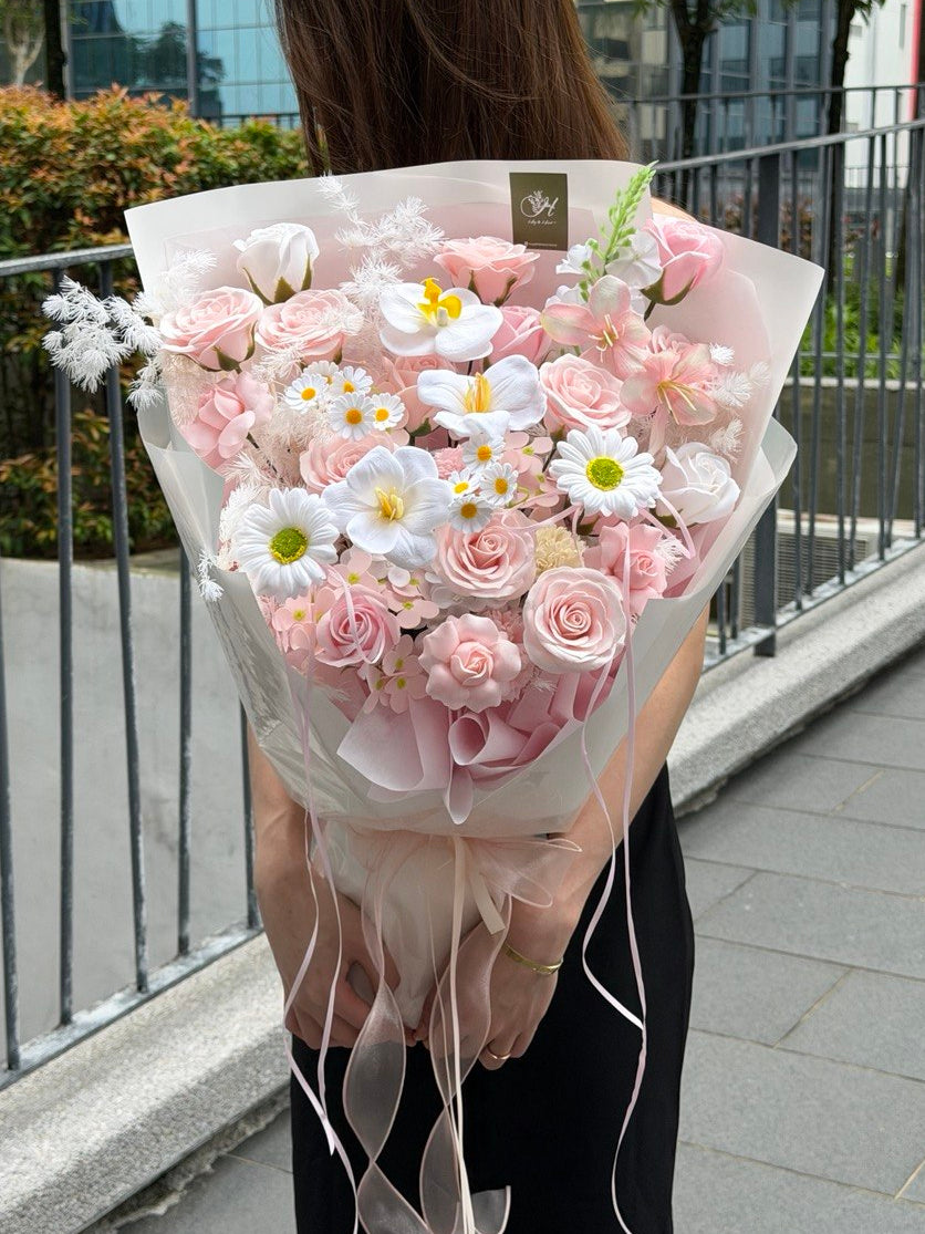 Valentine Soap Flower Bouquet featured pink rose, white tulip, gerbera, hana white, matthiola and kiss of fairy rose spray.