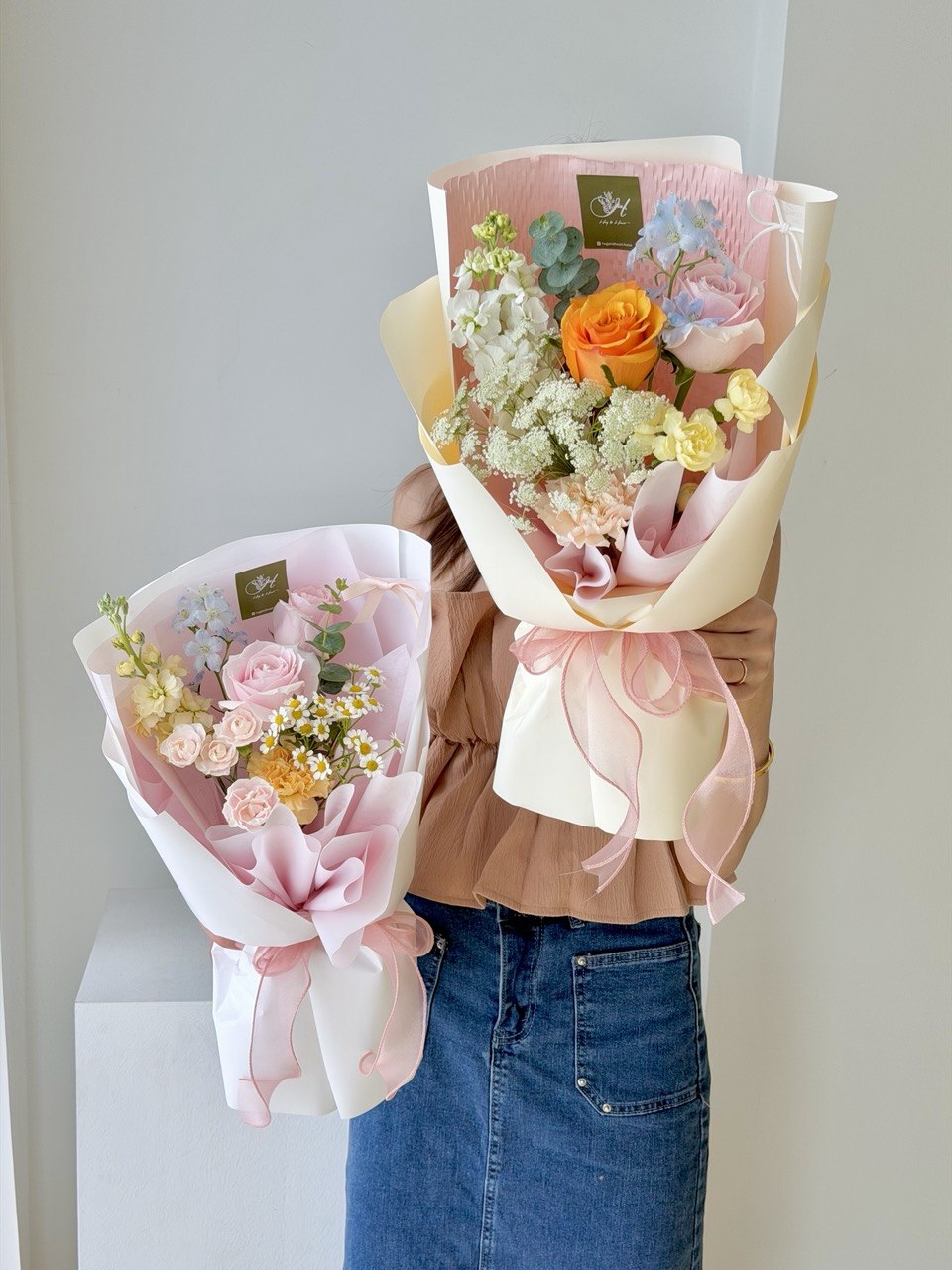 Two small handcrafted flower bouquets with roses and fillers, ideal for birthday gift delivery in Kuala Lumpur.