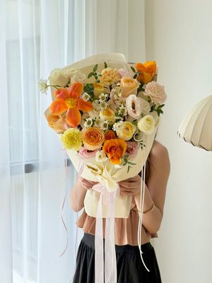Fresh mixed flower bouquet with vibrant orange tulip, garden roses, tulip, and carnations from Hug and Heart Florist Sunway Geo.