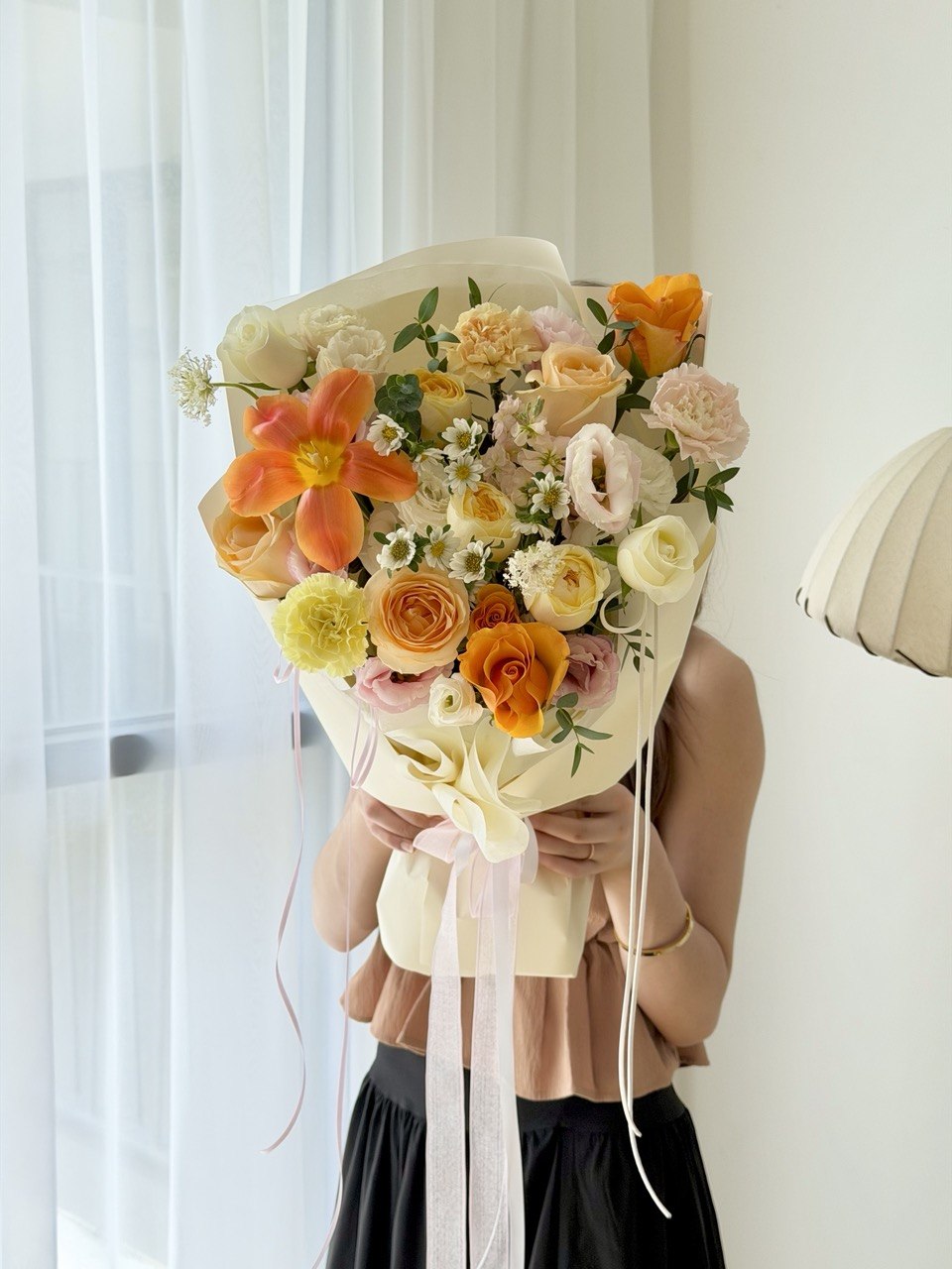Fresh mixed flower bouquet with vibrant orange tulip, garden roses, tulip, and carnations from Hug and Heart Florist Sunway Geo.