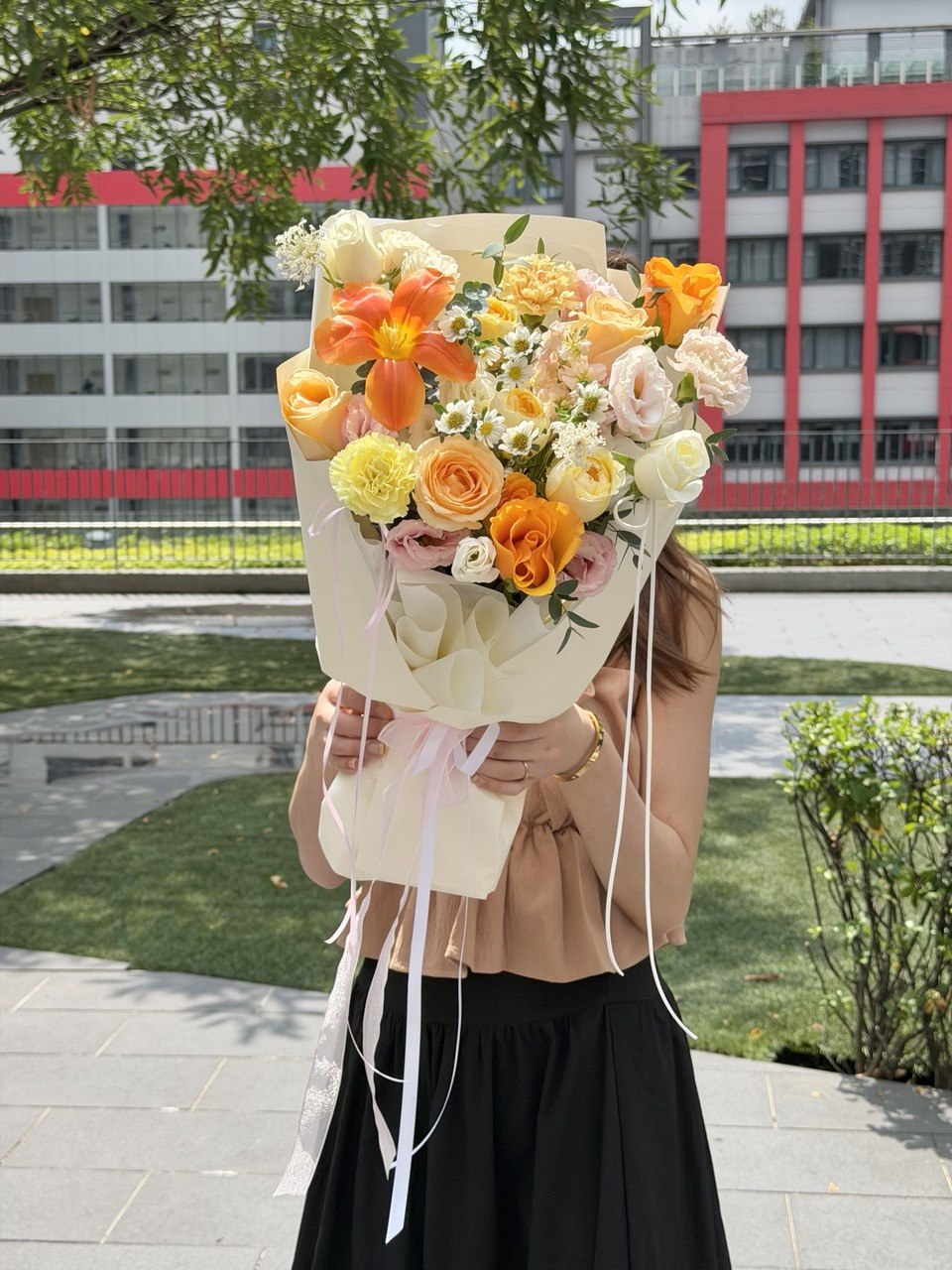 Same day flower delivery featuring an elegant orange tulip bouquet with pastel roses and seasonal blooms by Hug and Heart Florist Sunway Geo.