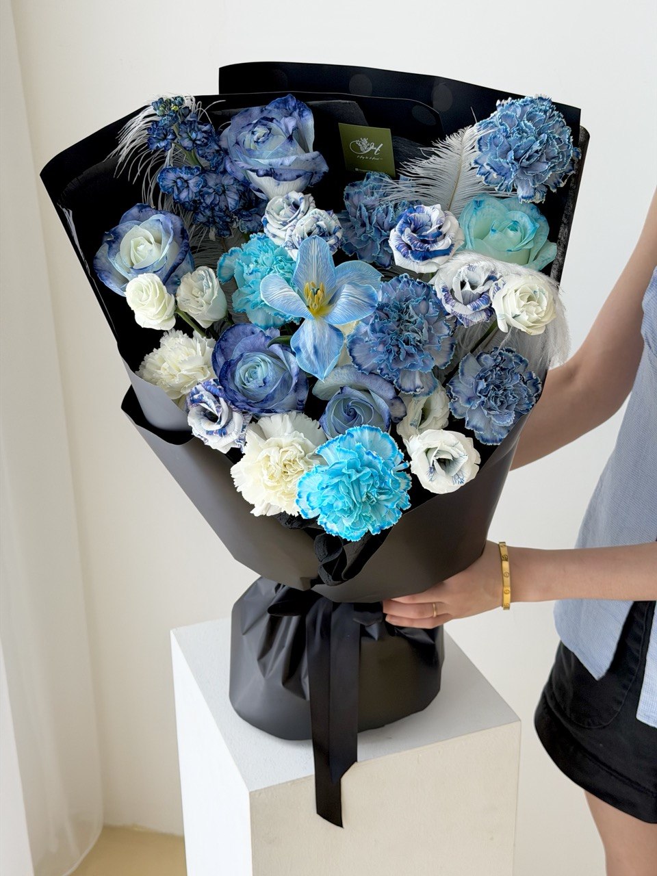Elegant blue themed flower bouquet in black wrapping, ideal masculine flower gift with same day delivery Klang Valley.