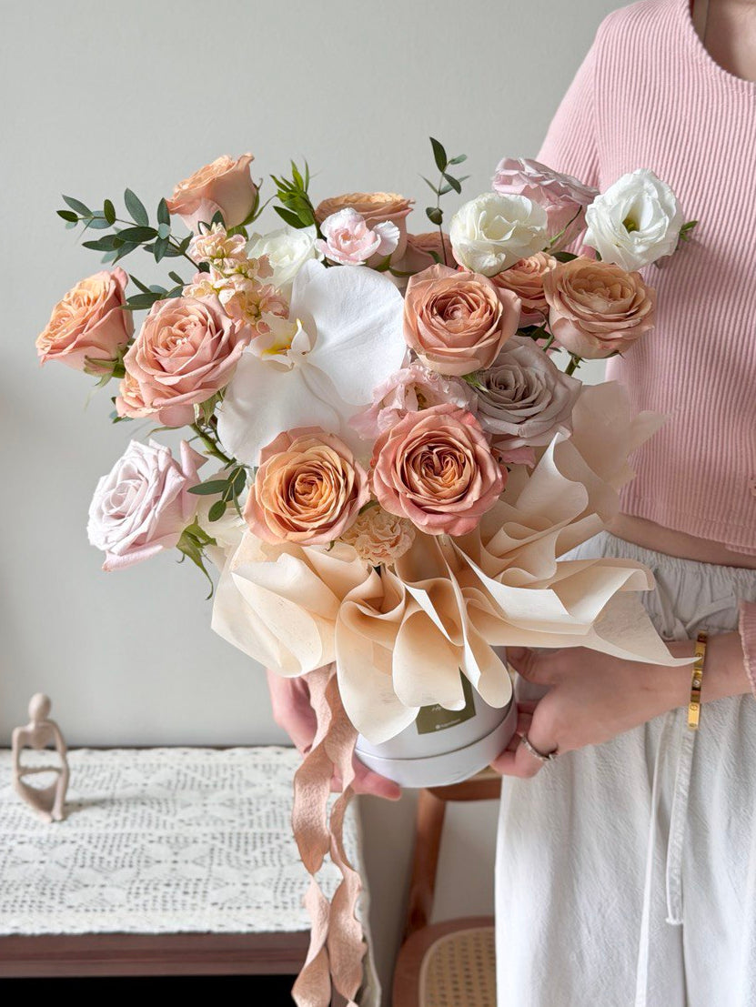 Cappuccino rose flower basket with blush nude roses, white orchids and greenery, ideal for get well soon flower delivery in Kuala Lumpur KL.
