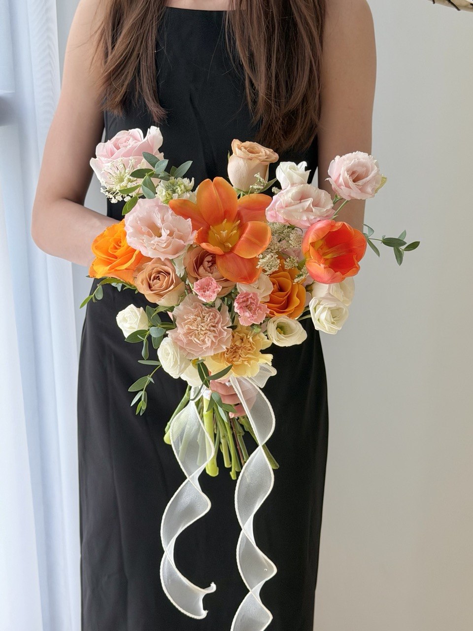Romantic orange tulip bridal flower bouquet designed with premium fresh flowers for wedding day, engagement and ROM ceremony in Kuala Lumpur.