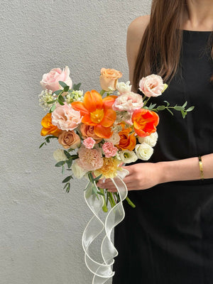 Elegant orange tulip wedding bouquet handcrafted with seasonal flowers for brides, ROM ceremony and bridal photoshoot in Malaysia.