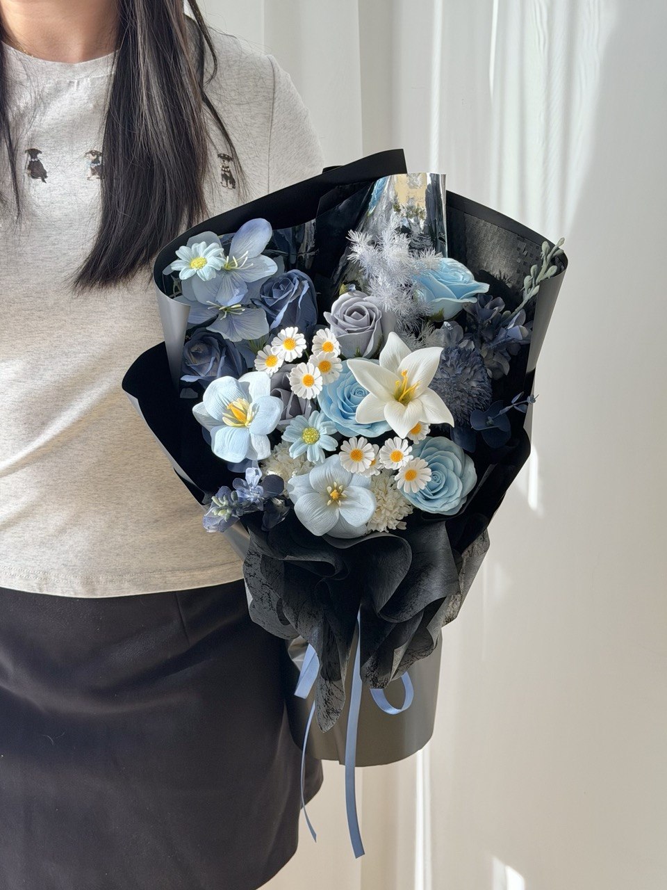 Luxury dark blue soap flower bouquet with white lily, pastel blue roses, tulips, and preserved floral accents for graduation, birthday, and anniversary gifts.